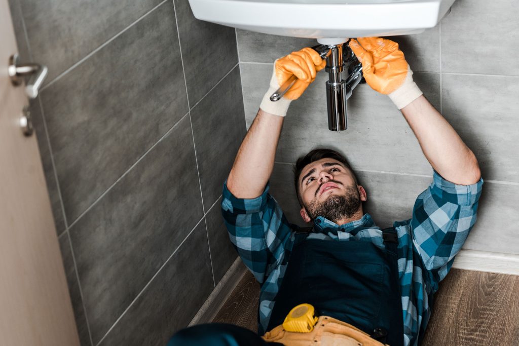 selective focus of repairman fixing water damage w 2021 08 30 01 48 05 7MNVJGB 1